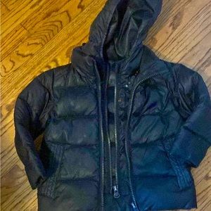 One kid road coat designed to use safely in car seat utilizing double zippers